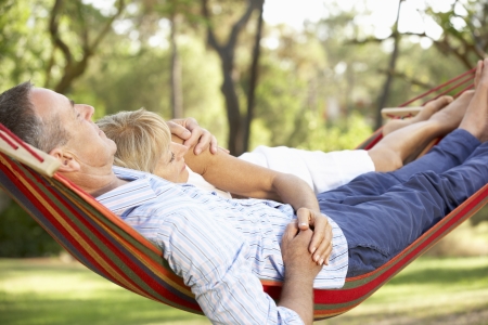 Senior Couple Relaxing In Hammockの写真素材
