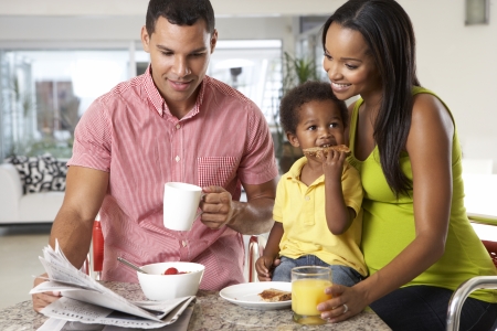 Family Having Breakfast In Kitchen Togetherの写真素材