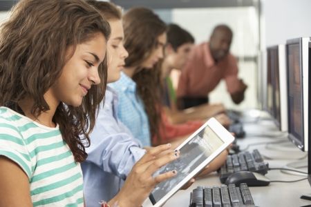 Girl Using Digital Tablet In Computer Classの写真素材