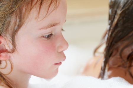 Two Girls Sharing Bubble Bathの写真素材