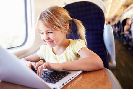 Girl Using Laptop On Train