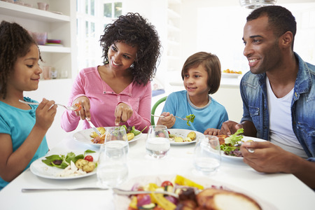 African American Family Eating Meal At Home Togetherの写真素材