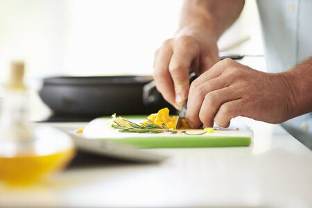 Close Up Of man Preparing Ingredients For Mealの写真素材