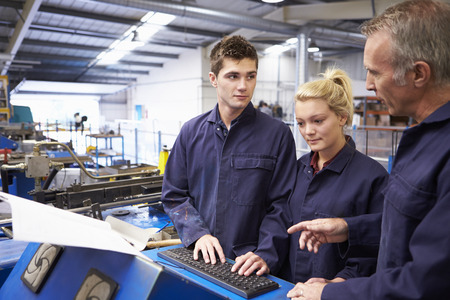 Engineer Teaching Apprentices To Use Tube Bending Machine