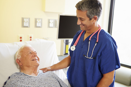 Male Doctor Talking With Senior Male Patientの写真素材