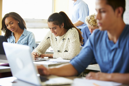 High School Students In Class Using Laptopsの写真素材