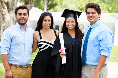 Hispanic Student And Family Celebrating Graduationの写真素材