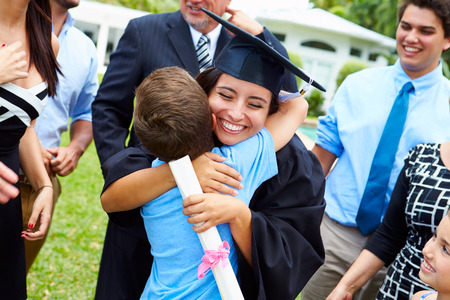 Hispanic Student And Family Celebrating Graduationの写真素材