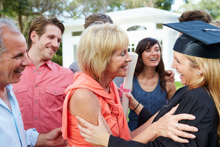 Female Student And Family Celebrating Graduation