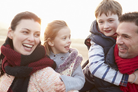 Portrait Of Family On Winter Beachの写真素材