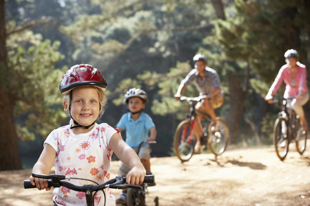 Young family on country bike ride