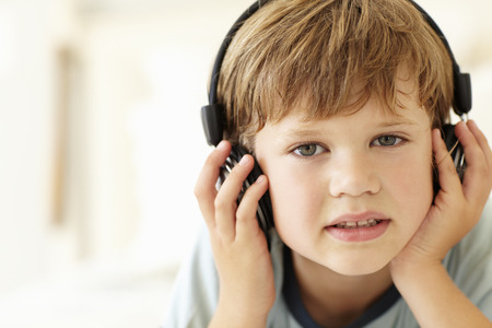 Young boy wearing headphonesの写真素材
