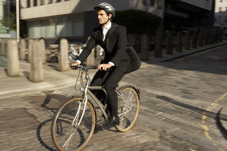 Businessman cycling to work