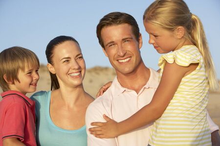 Portrait Of Young Family On Beach Holiday