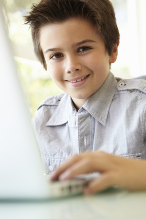 Hispanic Boy Using Laptopの写真素材