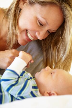 Mother talking to babyの写真素材