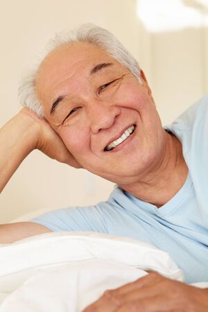 Senior Taiwanese man resting