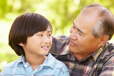 Boy and grandfather outdoors