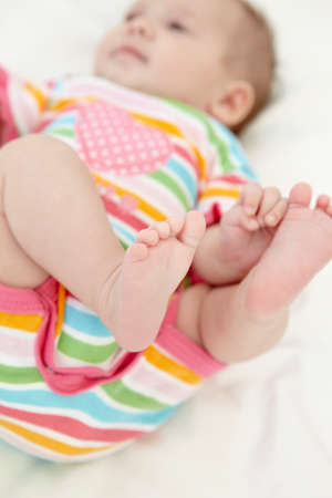 Baby Girl Playing With Toesの写真素材