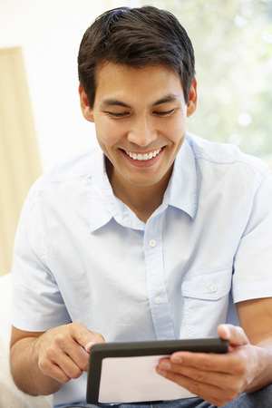 Asian man using tabletの写真素材