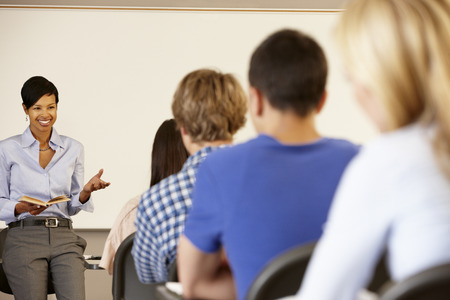 African American teacher teaching at front of classの写真素材