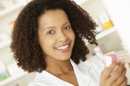 UK Female nurse in pharmacyの写真素材