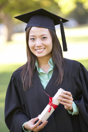 Female Student Attending Graduation Ceremonyの写真素材