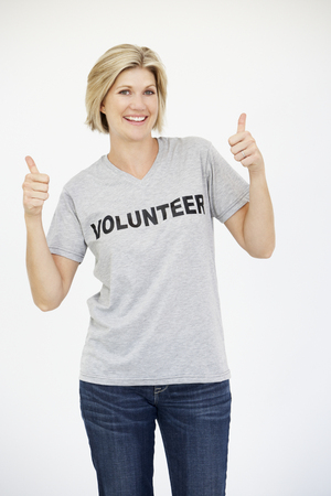 Portrait Of Female Volunteer Giving Thumbs Upの写真素材