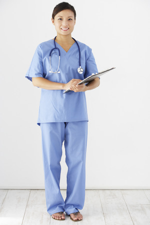 Studio Portrait Of Nurse Against White Backgroundの写真素材