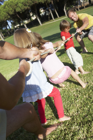 Fathers And Children Playing Tug Of Warの写真素材