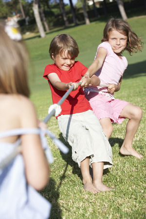 Children Playing Tug Of Warの写真素材