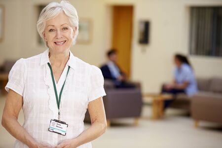 Portrait Of Female Consultant In Hospital Receptionの写真素材