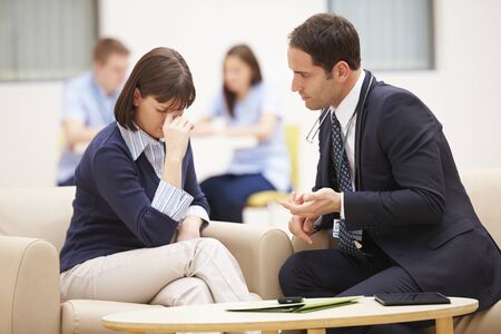Woman Discussing Test Results With Doctorの写真素材