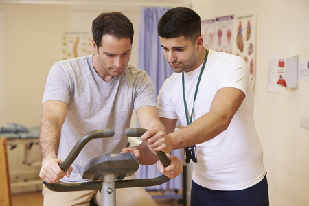Patient Having Physiotherapy On Trampoline In Hospitalの写真素材