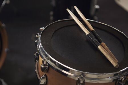 Close Up Of Sticks Resting On Snare Drumの写真素材