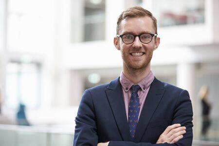 Head And Shoulders Portrait Of Businessman In Office