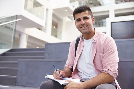 Portrait Of Male University Student In Campus Buildingの写真素材