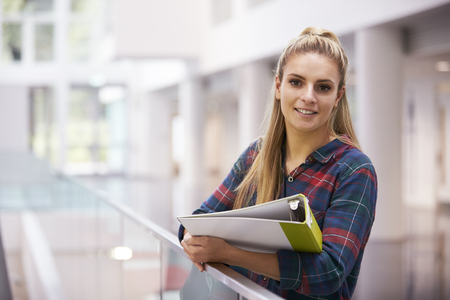 Female adult student in modern university building, portraitの写真素材