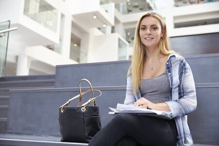 Portrait Of Female University Student In Campus Buildingの写真素材