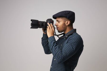Studio Portrait Of Male Photographer With Cameraの写真素材