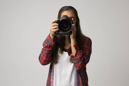 Studio Portrait Of Female Photographer With Cameraの写真素材