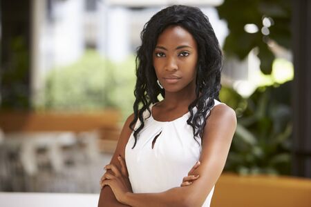 Portrait of young black businesswoman with arms crossedの写真素材