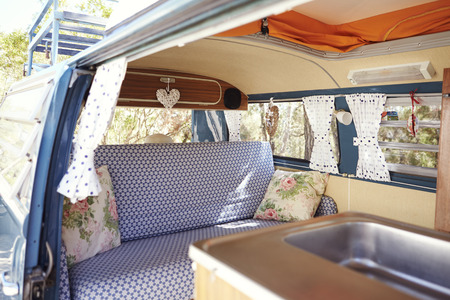 A retro camper van, with door open to show interiorの写真素材