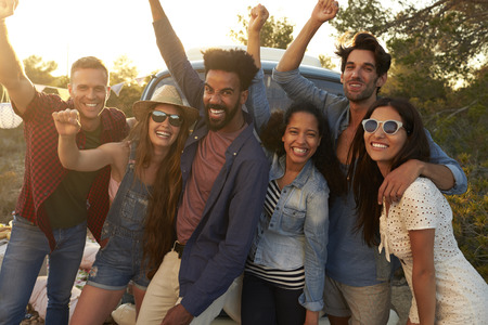 Friends on a road trip holiday look to camera, full lengthの写真素材