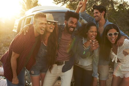 Group shot of friends on a road trip posing together