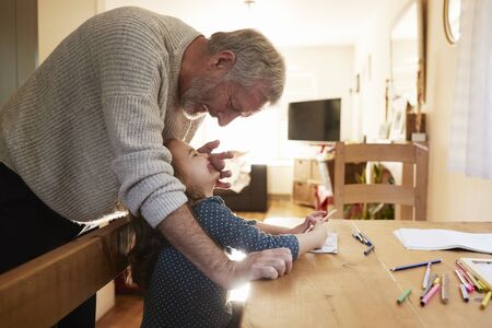 Grandfather And Granddaughter Colouring Picture Togetherの写真素材