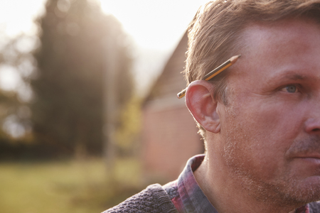 Mature Workman With Pencil Behind His Earの写真素材