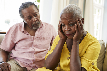 Senior Man Comforting Woman With Depression At Homeの写真素材