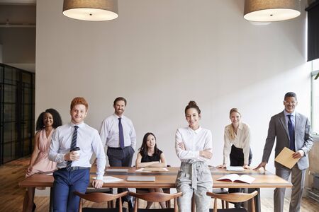 Young professionals at a business meeting looking to cameraの写真素材