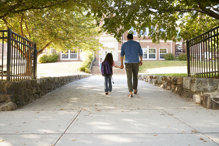 Father Dropping Off Daughter In Front Of School Gatesの写真素材